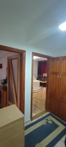 a room with a door and a room with a bedroom at Fenix in Sarajevo