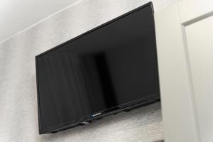 Televízia a/alebo spoločenská miestnosť v ubytovaní Elegant Apartments