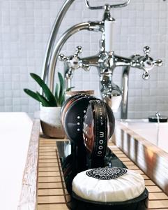 a hair dryer sitting on a counter in front of a sink at Domus Portus in Dendermonde