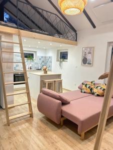 a bedroom with a loft bed and a kitchen at Apartma Tany in Ljubljana