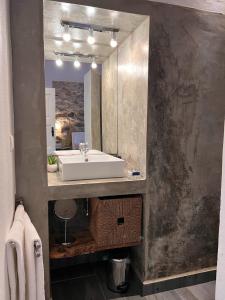 a bathroom with a sink and a mirror at Casa Dos Galegos in Marvão +59 photos