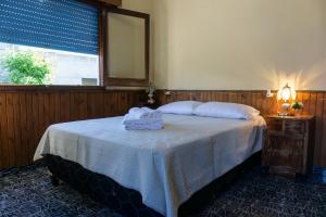 En eller flere senge i et værelse på Mi casa es tu casa