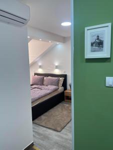 Postel nebo postele na pokoji v ubytování Guest House LILA