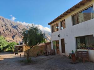 a house with a view of a mountain at Cabañas APU in Maimará
