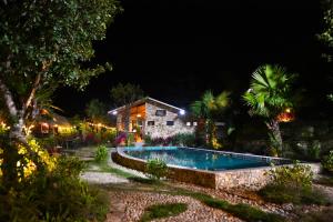 Swimmingpoolen hos eller tæt på TVpalm Ecolodge