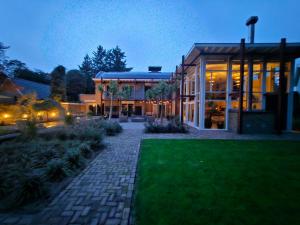 a building with a brick walkway in front of a building at Artz of Nature in Emmen