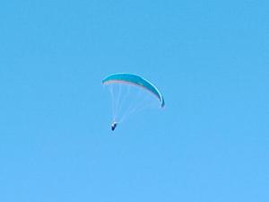 a blue and white parachute flying in the sky at Seyon Homestay in Kalimpong