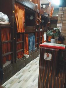 a room with wooden walls and a counter in a room at Kalina Asian Dormitory in Mumbai