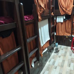 a group of bunk beds in a room at New Asian Dormitory in Mumbai