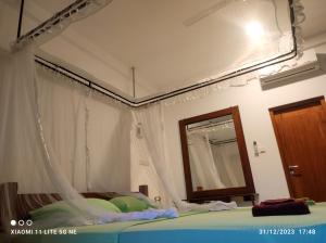 Postel nebo postele na pokoji v ubytování Villa Tanzanite Hikkaduwa