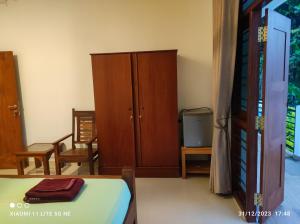 Postel nebo postele na pokoji v ubytování Villa Tanzanite Hikkaduwa