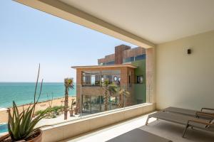 a room with a large window overlooking the beach at Dakhla South Bay in Dakhla