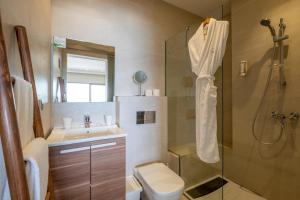a bathroom with a shower and a toilet and a sink at Dakhla South Bay in Dakhla