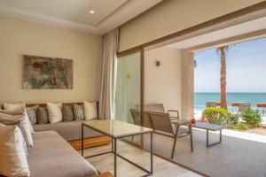 a living room with a couch and a table at Dakhla South Bay in Dakhla