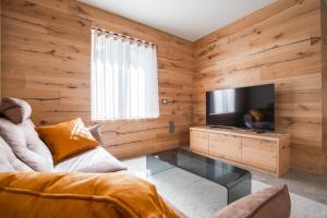 TV a/nebo společenská místnost v ubytování Ca' Leonardi - Valle di Ledro