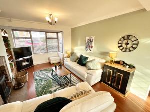 a living room with two couches and a fireplace at Beautiful 3-Bed House in Chester-le-Street in Chester-le-Street