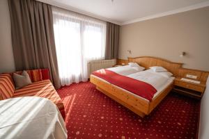 Łóżko lub łóżka w pokoju w obiekcie Haus Kössler