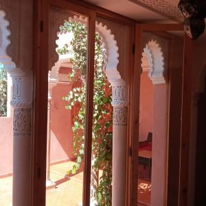 a room with a door with a plant at Villa Paradis in Marrakech