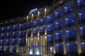 a hotel with blue lights on the front of it at Arena Mar Hotel and SPA in Golden Sands