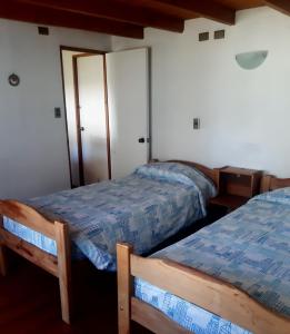 Postel nebo postele na pokoji v ubytování Cabaña Pucón 2 personas