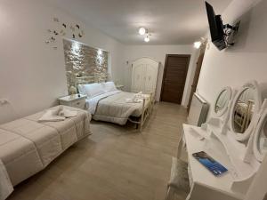 A bed or beds in a room at B&B I Giardini