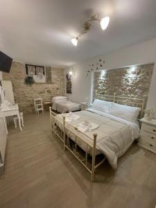 A bed or beds in a room at B&B I Giardini