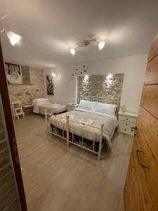 A bed or beds in a room at B&B I Giardini