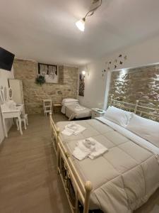 A bed or beds in a room at B&B I Giardini