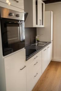 Kuchyň nebo kuchyňský kout v ubytování MOREHOME-Apartments Oldtown Flair
