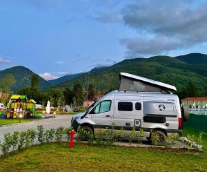 a white van parked on the side of a road at 7 Lakes camping in Sapareva Banya