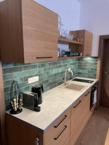 Kuchyňa alebo kuchynka v ubytovaní Apartmán Sirius
