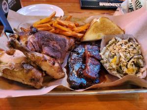 a tray of food with meat and french fries at Cozy Swamp Rabbit - Sans Souci Greenville Furman in Greenville