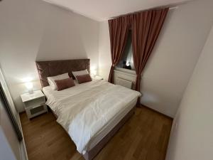 Ένα ή περισσότερα κρεβάτια σε δωμάτιο στο Apartman Besta +7 φωτογραφίες