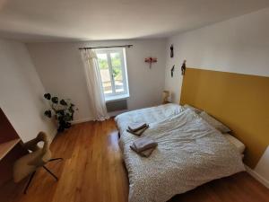 Postel nebo postele na pokoji v ubytování L'Alambic à Martial