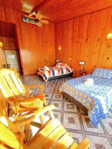 מיטה או מיטות בחדר ב-Miztli Lodge & Adventure