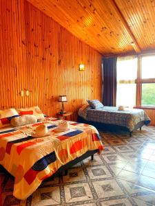 מיטה או מיטות בחדר ב-Miztli Lodge & Adventure