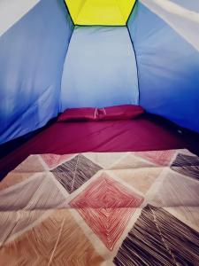 a close up of a bed in a tent at Jurema Camping in Itacaré