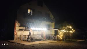 a building at night with lights in front of it at Gorec in Yaremche