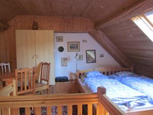 A bed or beds in a room at Bozsoki Pihenő