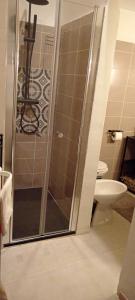 a bathroom with a shower and a toilet at Casa vacanze San Giovanni nei Sassi in Matera