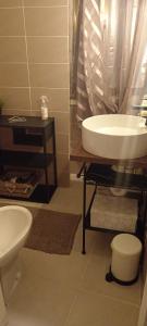 a bathroom with a sink and a tub and a toilet at Casa vacanze San Giovanni nei Sassi in Matera