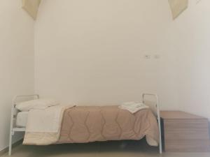 Ένα ή περισσότερα κρεβάτια σε δωμάτιο στο A Casa di Tina