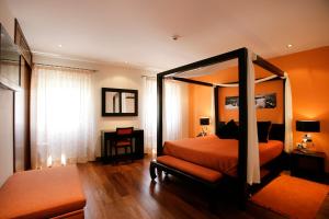 Uma cama ou camas num quarto em Casa Dos Poos