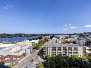 an aerial view of a city with a river and buildings at Amazing cityview Glamourous 2BR Apt w parkpool in Brisbane