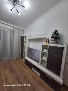 A television and/or entertainment centre at TbiliHome Még 33 kép