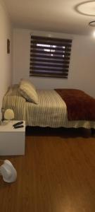Una cama o camas en una habitación de Cabañas Don Emilio