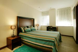 Uma cama ou camas num quarto em Casa Dos Poos