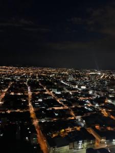 an aerial view of a city at night at TORRE DE CALI - Fabulosos Apartaestudios pisos 6, 7, 10, 25, 28, 30, 39 in Cali