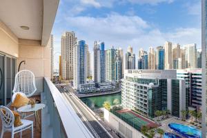 a balcony with a view of a city at Luxury 1 Bedroom Marina View, Sleeps 6, 1 Min to Metro in Dubai +65 photos