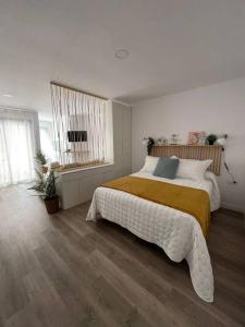 En eller flere senge i et værelse på Apartamento Azul en Sotogrande